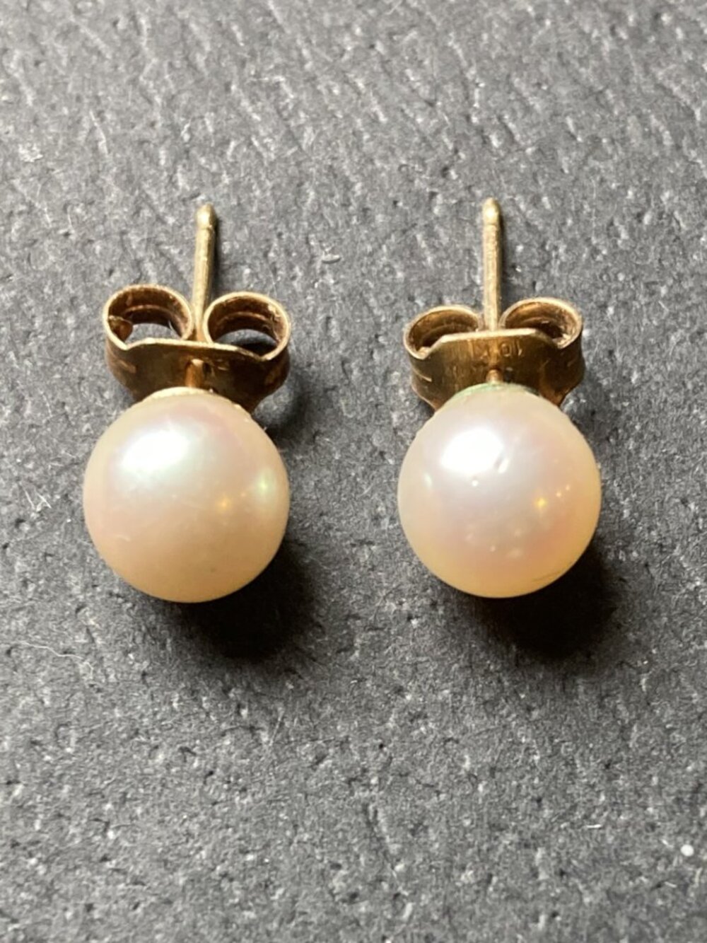 Perfect pair of pearl earrings set in 10K gold